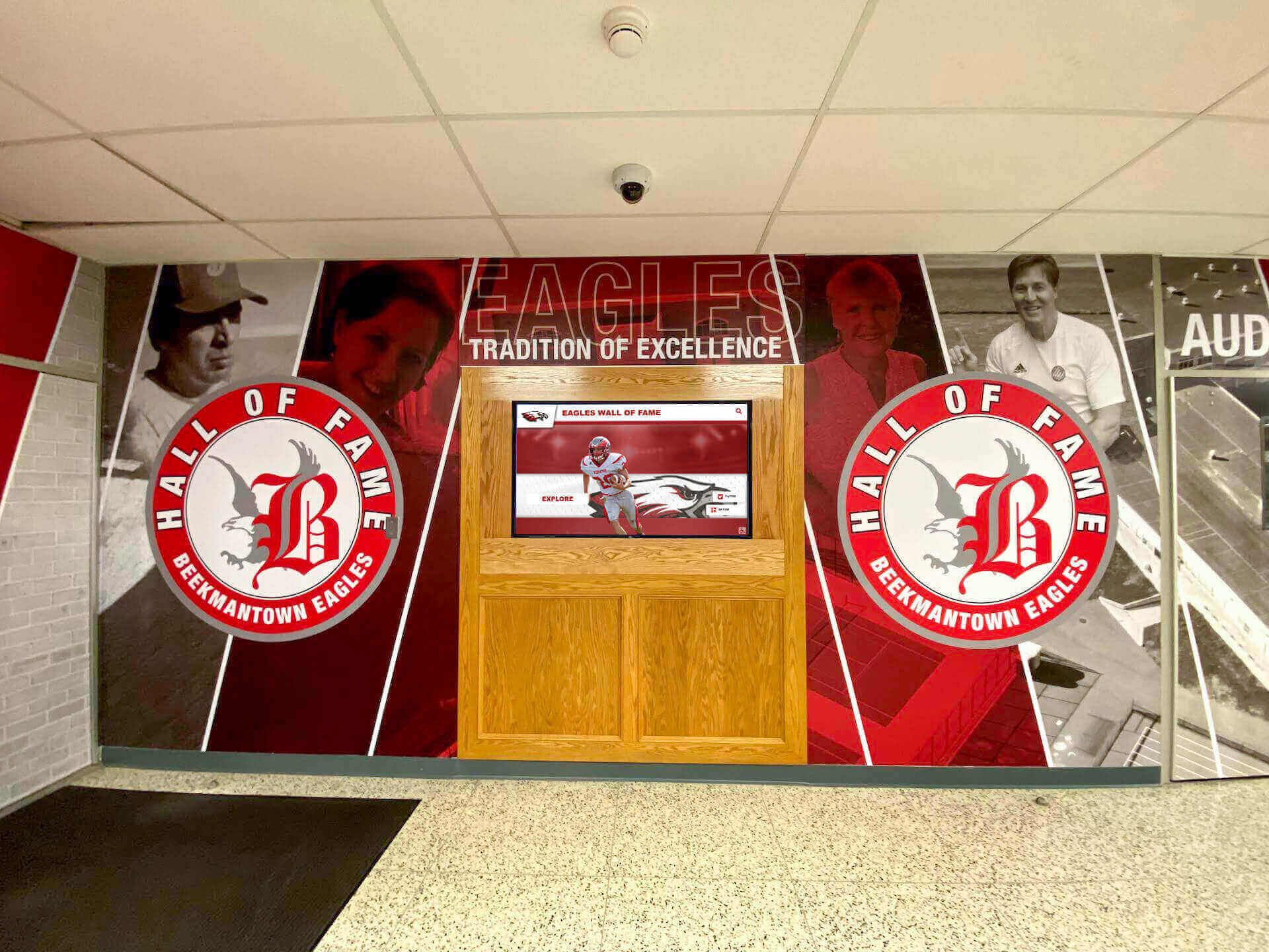 Team recognition wall in school lobby